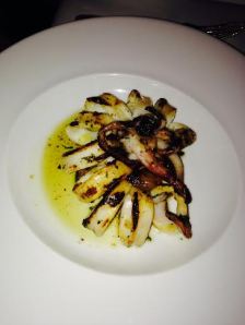 Grilled Squid w/fresh coriander, lemon, garlic, extra virgin olive oil served with roasted sweet peppers, charred tomato and caramelized leeks $15