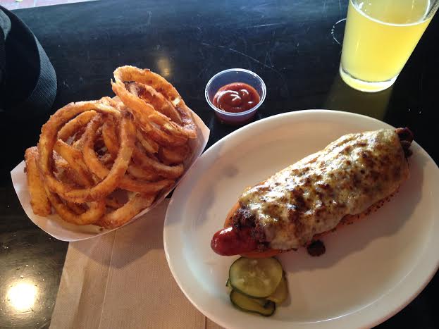 Chili Cheese Dog ($10), onion rings ($5) and a Happy hour $4 pint